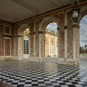An open colonnade where architecture and nature meet. The marble columns frame the gardens beyond, while the geometry of the floor draws the eye through the space. The repetition of arches, columns and squares creates a precise architectural rhythm, softened by the irregular patterns of the marble and the landscape beyond. What interests me here is the conversation between the two: the order imposed by architecture and the less predictable forms of nature. For a moment, neither dominates. Stone and garden become parts of the same composition, connected by light, pattern and perspective.